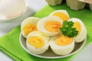 "Boiled eggs, rich in protein, healthy fats, and vitamin D, served with a dash of salt or pepper for a quick, nutritious snack."