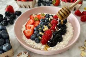 "Cottage cheese with fresh fruit, a protein-packed and vitamin-rich snack."